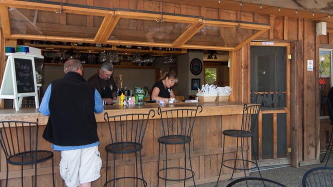 From the dining patio you can belly-up to the bar.