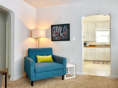 A comfy living room invites you to sit down and enjoy the mountain view out the big front windows.