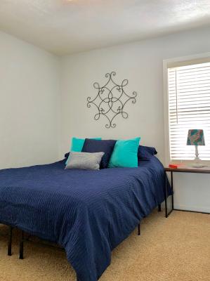 Bedroom 2 features a queen bed with a comfy memory foam mattress.